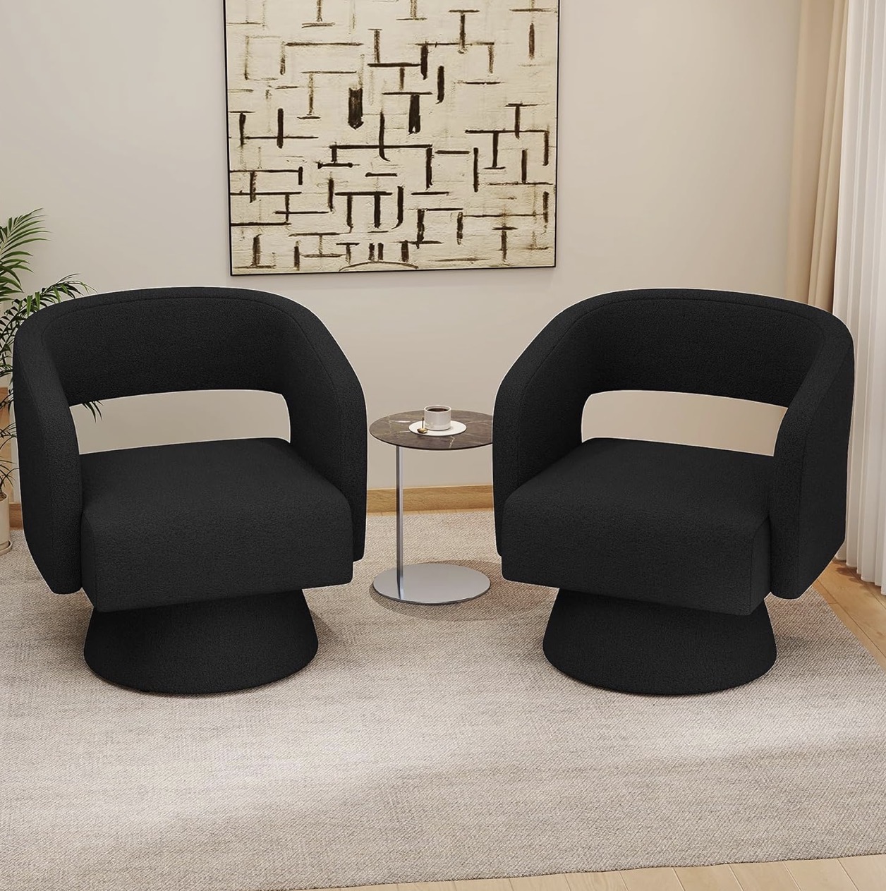 Pair of curved black barrel accent chairs