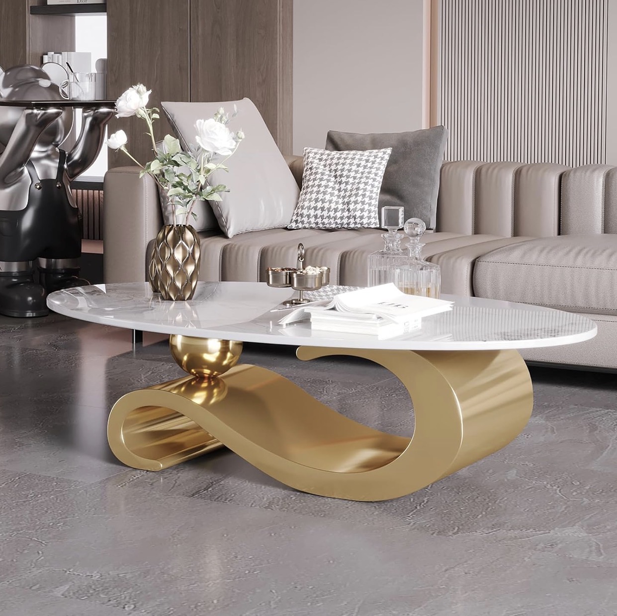 Oval white marble coffee table with sculptural gold base